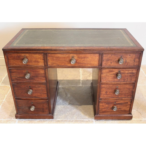 685 - A 19th century mahogany faux partners desk, the rectangular top with an inset gilt tooled green skiv... 