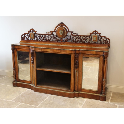 691 - A mid 19th century burr walnut breakfront credenza, the scrolling foliate openwork back rail centred... 