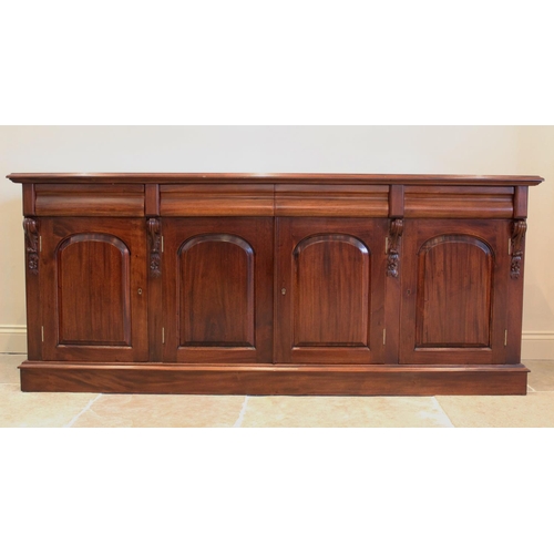 692 - A Victorian style mahogany sideboard, late 20th century, the rectangular moulded top above four cush... 