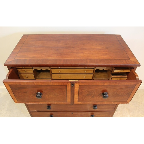 693 - An early 19th century mahogany and satinwood cross banded secretaire chest of drawers, the fall fron... 