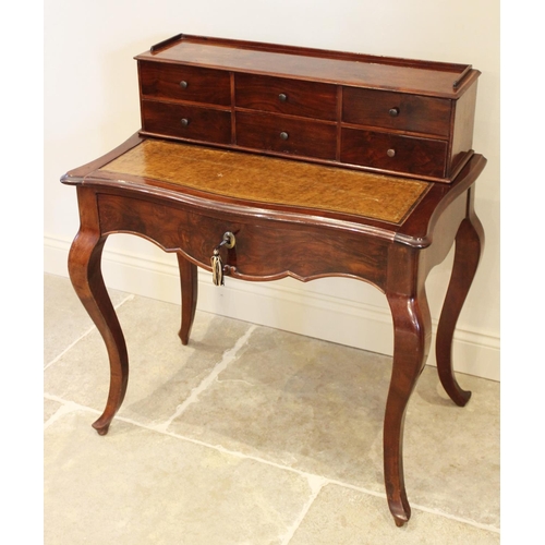 698 - A Louis XV style walnut bonheur du jour, late 19th/early 20th century, the raised back with an arran... 