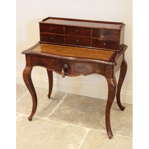 698 - A Louis XV style walnut bonheur du jour, late 19th/early 20th century, the raised back with an arran... 