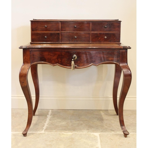 698 - A Louis XV style walnut bonheur du jour, late 19th/early 20th century, the raised back with an arran... 