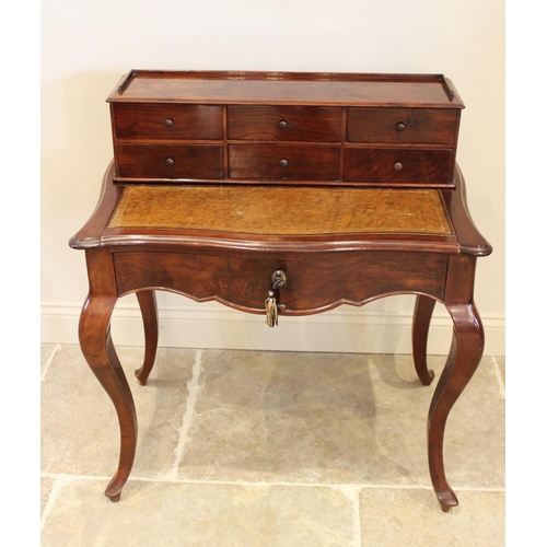 698 - A Louis XV style walnut bonheur du jour, late 19th/early 20th century, the raised back with an arran... 