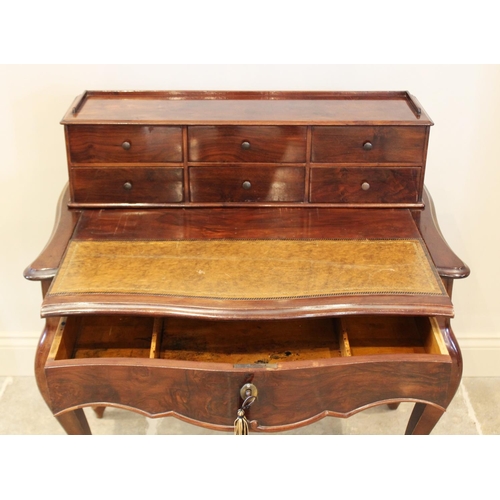 698 - A Louis XV style walnut bonheur du jour, late 19th/early 20th century, the raised back with an arran... 