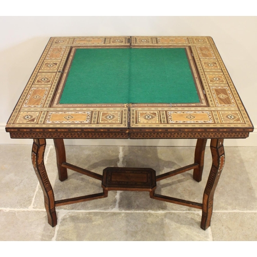 699 - A late 19th century Syrian Damascus mother or pearl and bone parquetry hardwood games table, applied... 