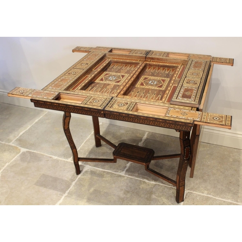 699 - A late 19th century Syrian Damascus mother or pearl and bone parquetry hardwood games table, applied... 