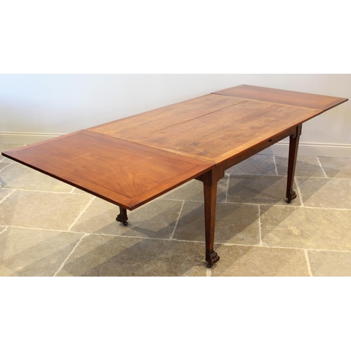 700 - A 19th century French cherry wood draw leaf dining table, the rectangular table top above an angular... 