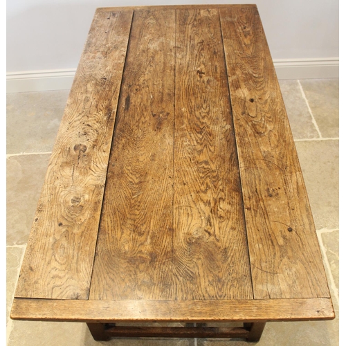 701 - A 19th century and later elm kitchen table, the cleated plank top raised upon legs of square section... 