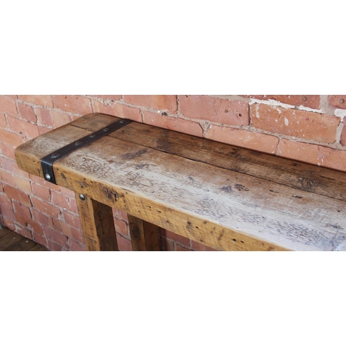 706 - A rustic hardwood and iron bound console table, the slab top applied with rivet detail iron work, up... 