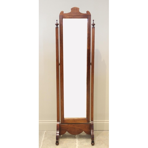 707 - An early 20th century walnut framed cheval mirror, the rectangular bevelled plate raised upon uprigh... 