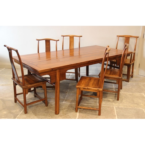 720 - A Chinese elm dining table with six associated chairs, second quarter 20th century, the table with a... 