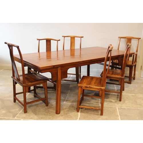 720 - A Chinese elm dining table with six associated chairs, second quarter 20th century, the table with a... 