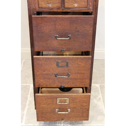 723 - An early 20th century 'Shannon' oak filing cabinet, circa 1930, applied with the makers name above f... 