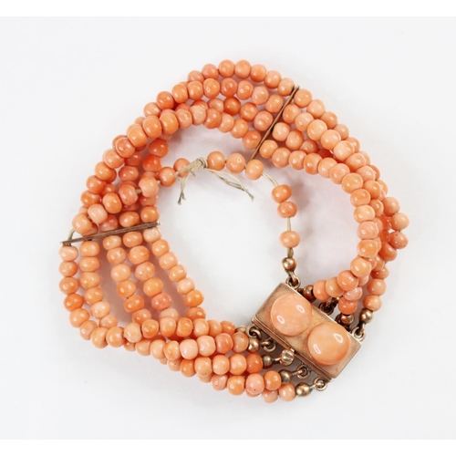 95 - A Victorian three row coral beaded choker necklace, comprising three rows of graduated polished cora... 