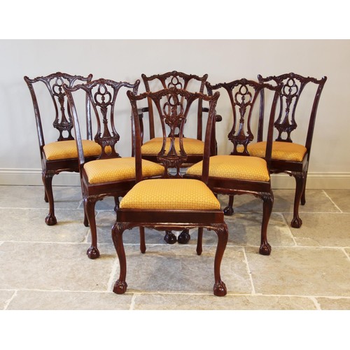 704 - A set of ten Chippendale style mahogany dining chairs, late 20th century, each with an interlaced sp... 