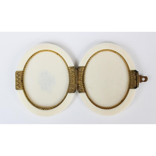 177 - A Victorian ivory locket form twin miniature frame, late 19th century, the two vacant apertures with... 