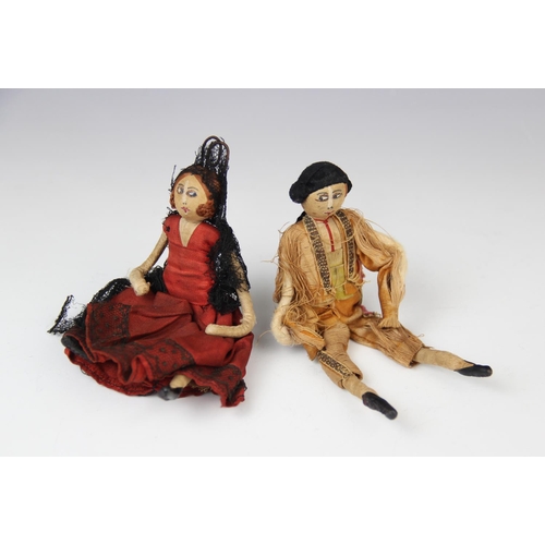 186 - Two silk Spanish dolls, early 20th century, one modelled as a matador, 14cm high, the other as a fla... 