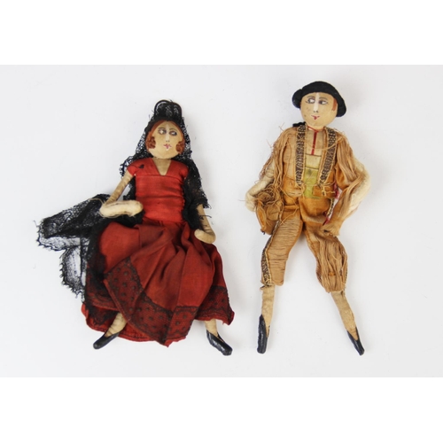 186 - Two silk Spanish dolls, early 20th century, one modelled as a matador, 14cm high, the other as a fla... 