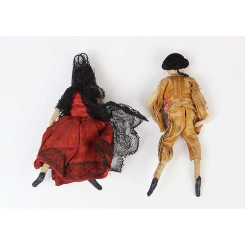 186 - Two silk Spanish dolls, early 20th century, one modelled as a matador, 14cm high, the other as a fla... 