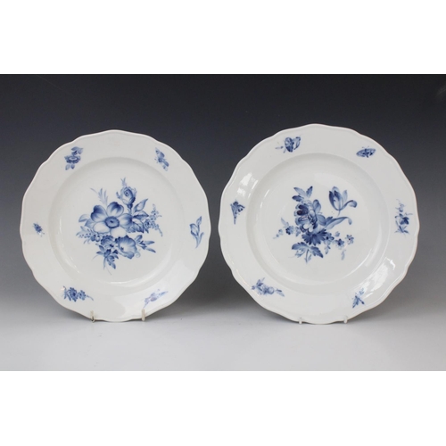 244 - Four Meissen blue and white plates, 19th century, each decorated with central floral spray, with flo... 