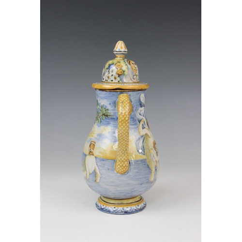 256 - An Italian faience ewer and cover in the manner of Cantagalli, 20th century, decorated with a landsc... 