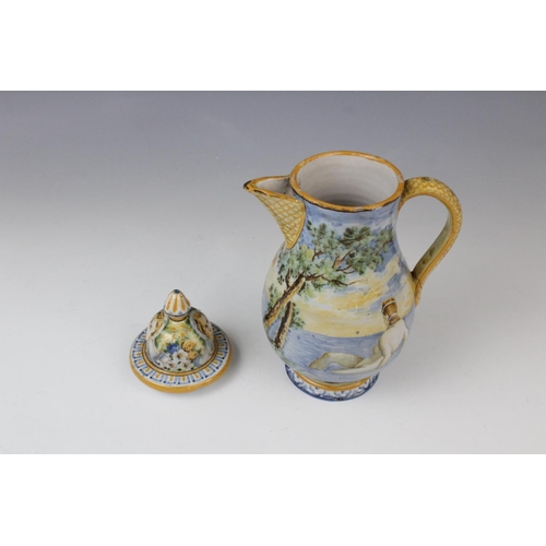 256 - An Italian faience ewer and cover in the manner of Cantagalli, 20th century, decorated with a landsc... 