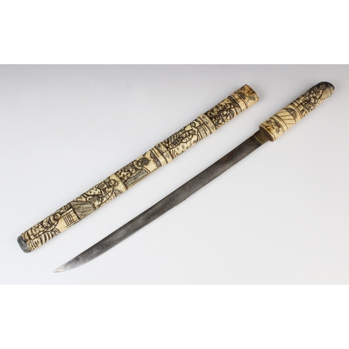 265 - A Japanese tanto, Meiji period (1868-1912), blade 40cm long within a extensively carved bone sheath ... 