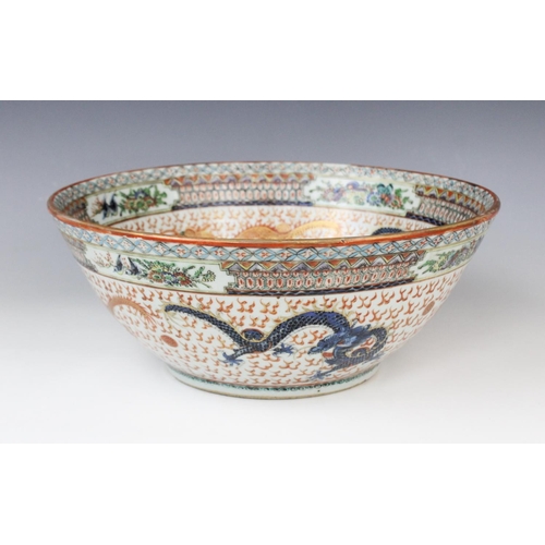 292 - A Chinese porcelain Cantonese rose bowl, 19th/20th century, decorated in rouge-de-fer palettes with ... 