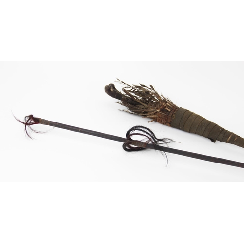 300 - A Naga Tribe spear, 19th century, with barbed iron terminal and carved figural shaft with dyed feath... 