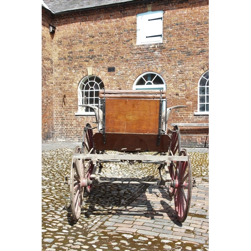 314 - A 19th/20th century horse drawn carriage/trap, the 7ft long cart supporting four iron wheels, the re... 