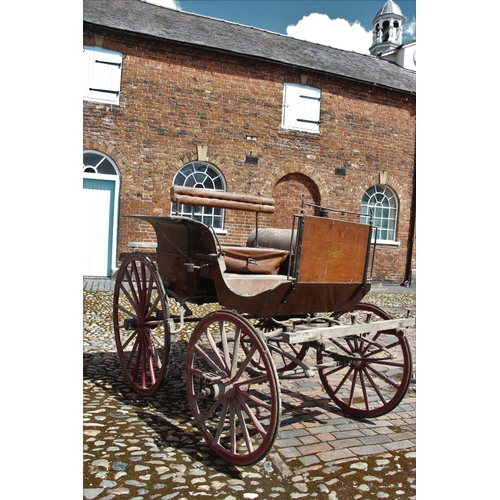 314 - A 19th/20th century horse drawn carriage/trap, the 7ft long cart supporting four iron wheels, the re... 