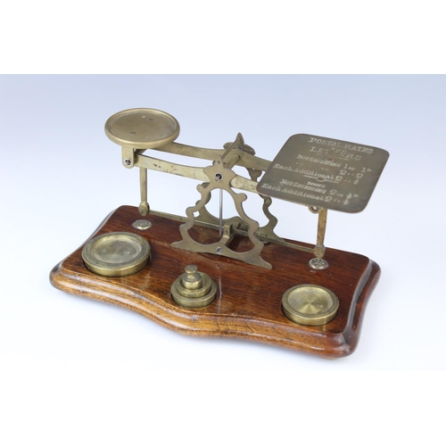 359 - A set of brass postal scales, 20th century, the balance bar stamped 'Warranted Accurate', the plate ... 