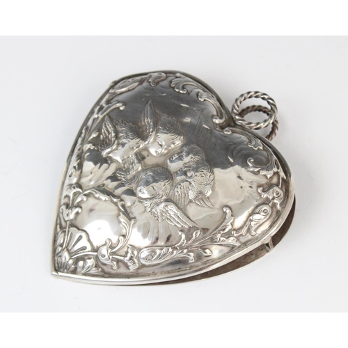 49 - A Victorian silver desk clip by William Comyns, London 1896, in the shape of a heart decorated with ... 