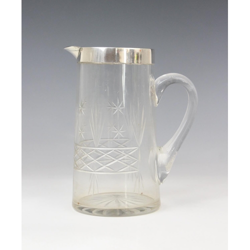 54 - A George V cut glass silver mounted jug, marks for John Grinsell & Sons, Birmingham 1924, of tapered... 