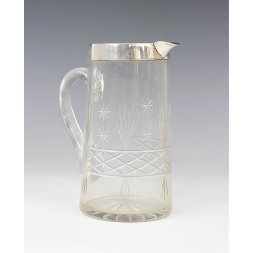 54 - A George V cut glass silver mounted jug, marks for John Grinsell & Sons, Birmingham 1924, of tapered... 