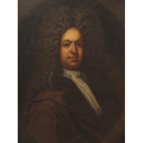 555 - Circle of Godfrey Kneller (1646-1723),
Portrait of Thomas Kenyon in a painted oval half length weari... 