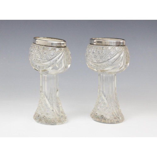 56 - A pair of George V cut glass silver mounted posy vases, marks for London 1914 (maker's marks worn), ... 