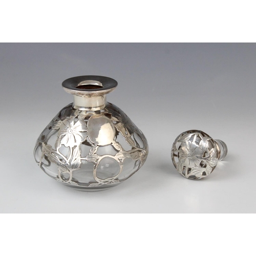 58 - An Art Nouveau glass scent bottle, of compressed baluster form with flared neck and stopper, the col... 