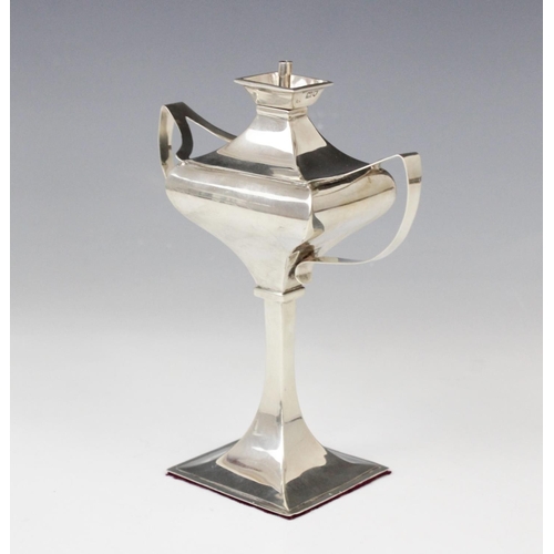 62 - A George V silver table lighter by Charles Boyton & Son Ltd, London 1912, of faceted form on tapered... 