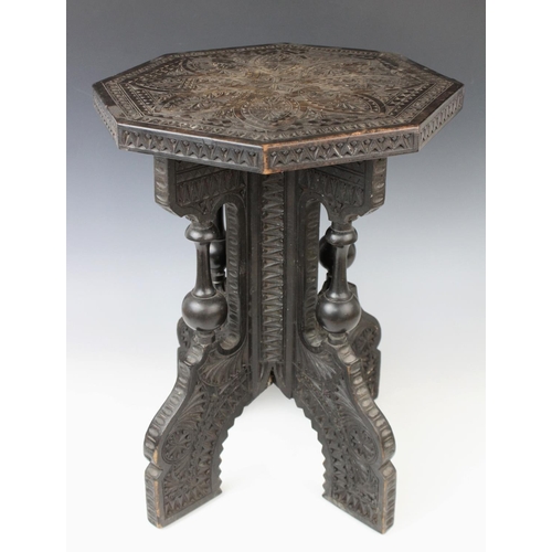 703 - An Anglo-Indian carved hardwood occasional table, early 20th century, the octagonal table top with c... 