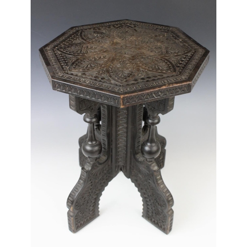 703 - An Anglo-Indian carved hardwood occasional table, early 20th century, the octagonal table top with c... 