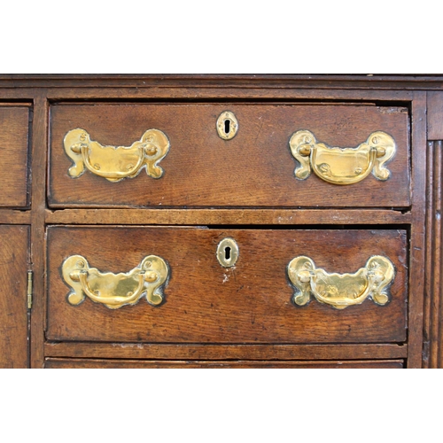 606 - A mid 18th century oak Welsh dresser, the inverted breakfront dresser rack with a moulded cornice ov... 