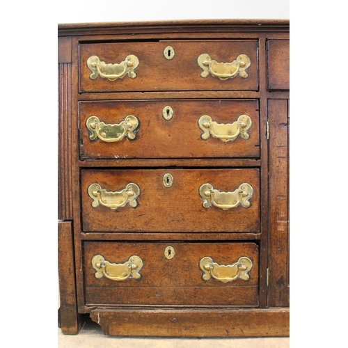 606 - A mid 18th century oak Welsh dresser, the inverted breakfront dresser rack with a moulded cornice ov... 