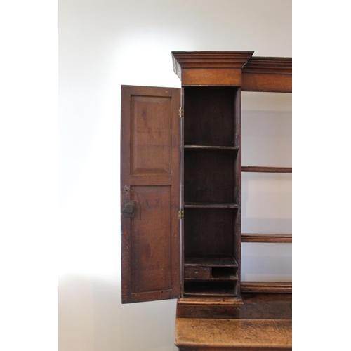 606 - A mid 18th century oak Welsh dresser, the inverted breakfront dresser rack with a moulded cornice ov... 