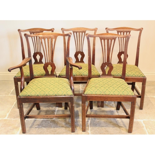 628 - A set of seven George III mahogany Hepplewhite style dining chairs, each chair with a pierced splat ... 