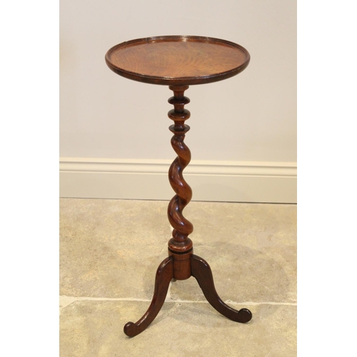 647 - A George III and later mahogany wine table, the circular mahogany tray top raised upon an associated... 