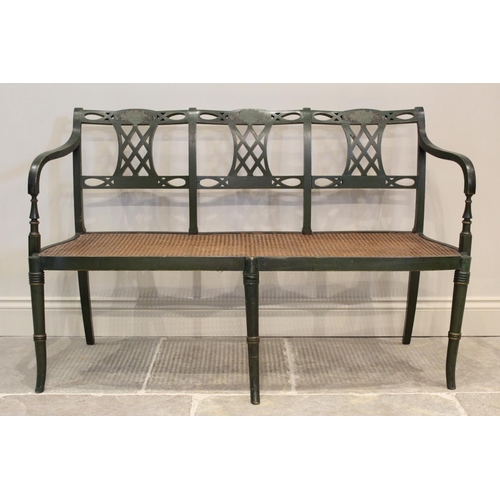 649 - A painted Regency style three seater settee, the rail back with three open work lattice splats above... 