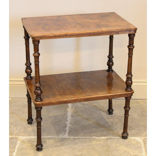 651 - A Victorian burr walnut two tier occasional table, the rectangular tiers raised raised upon turned s... 