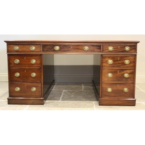 682 - A late 19th century mahogany partners desk, the rectangular moulded top inset with a gilt tooled red... 